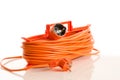 Orange extension cord isolated on white Royalty Free Stock Photo