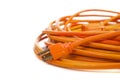 An orange extension cord on white Royalty Free Stock Photo