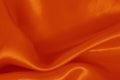 Orange fabric cloth texture for background and design art work, beautiful crumpled pattern of silk or linen Royalty Free Stock Photo