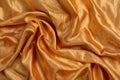 Orange fabric texture close-up. Crumpled and folded orange material with gray border frame. Natural brocade cloth pattern. Smooth Royalty Free Stock Photo