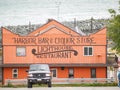 Orange facade of Harbour Bar & Liquor Store Restaurant