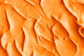 Orange facial mask pumpkin cream, body scrub texture close up. Abstract background Royalty Free Stock Photo