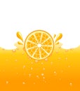 Orange falling into the orange juice Royalty Free Stock Photo