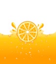 Orange falling into the orange juice Royalty Free Stock Photo