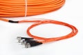 Orange fiber optic ST connector patchcord Royalty Free Stock Photo