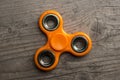 Orange fidget spinner Royalty Free Stock Photo