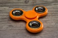 Orange fidget spinner Royalty Free Stock Photo