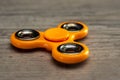 Orange fidget spinner Royalty Free Stock Photo