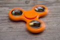 Orange fidget spinner Royalty Free Stock Photo