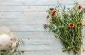 Orange field flowers, white women hat, copyspace, topview