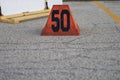 A orange fifty yard line marker ready for a marching band rehearsal Royalty Free Stock Photo