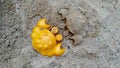 Orange figurine of crab and a crab made of sand in the sandbox Royalty Free Stock Photo