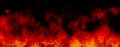 Orange fire or flames with sparkles and smoke in black background. Royalty Free Stock Photo