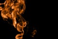 Orange fire smoke on black background Royalty Free Stock Photo