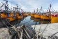 Orange fishing boats in Mar del Plata, Argentina