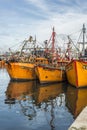 Orange fishing boats in Mar del Plata, Argentina