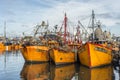 Orange fishing boats in Mar del Plata, Argentina