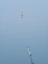 Orange fishing float or cork at the surface of the water Royalty Free Stock Photo