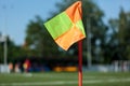 Orange flag on the corner place on the football field over blurred empty stadium.  Soccer background/ Royalty Free Stock Photo