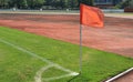 A orange flag at one corner of football,soccer field Royalty Free Stock Photo