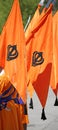 Orange flag with symbol of Sikh called Khanda during a ceremony
