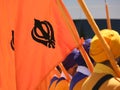Orange flag with symbol of the Sikh religion called KHANDA forme