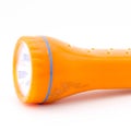 Orange flashlight isolated on white Royalty Free Stock Photo