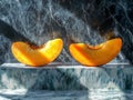 The orange flesh and stone inside a peach, cut in half Royalty Free Stock Photo