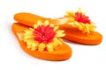 Orange flip-flops with flowers Royalty Free Stock Photo