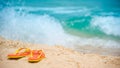 Orange flip flops or slippers on the beach Royalty Free Stock Photo