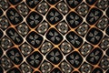 Orange floral pattern in a crooked cage on a black background.