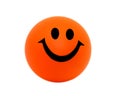 Orange foam ball with a smile.