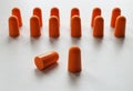 Orange foam ear plugs isolated on white background Royalty Free Stock Photo