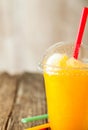 Orange Frozen Slushie in Plastic Cup with Straw Royalty Free Stock Photo