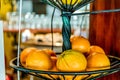 Orange fruit in the basket at the cafe bar.