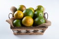 Orange fruit in the basket isolated. Tropical fruits. White background Royalty Free Stock Photo