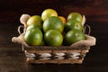 Orange fruit in the basket. Tropical fruits