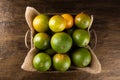 Orange fruit in the basket. Tropical fruits. Top view