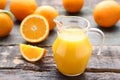 Orange fruit with jug of juice Royalty Free Stock Photo