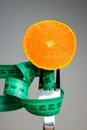 Orange fruit and measuring tape Royalty Free Stock Photo