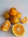 orange fruit in pieces, whole and half