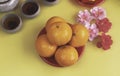 Orange Fruit plate put beside pink flower on background Royalty Free Stock Photo