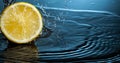 Orange fruit slice in water splash stream Royalty Free Stock Photo