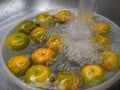 The Orange fruit soaks and wash in the water Royalty Free Stock Photo