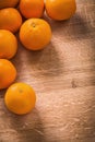 Orange fruits with organized copyspace on wooden