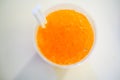 Orange fruity punch with crushed ice in plastic cup with double Royalty Free Stock Photo