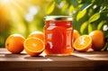 a jar of orange jam on a wooden table, on the background of a plantation of orange trees to the horizon, branches