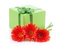 Orange gerbera flowers and gift box Royalty Free Stock Photo