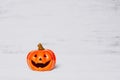 Orange ghost pumpkins on grunge rusty white wooden borad background with copy space for your text. halloween background minimal