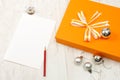 Orange gift box with silver christmas baubles Royalty Free Stock Photo